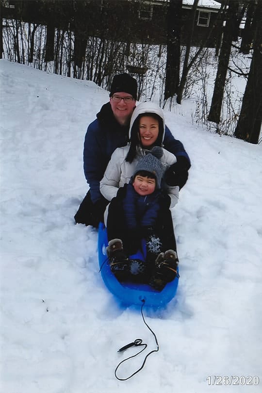 Andy and his family enjoying the snow