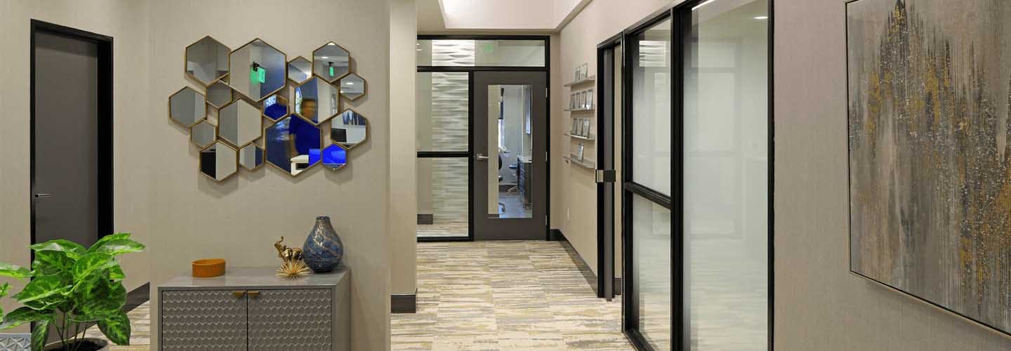 The durable but attractive finishes and textures of a branded dental office as shown at Skyridge Dental in Austin TX