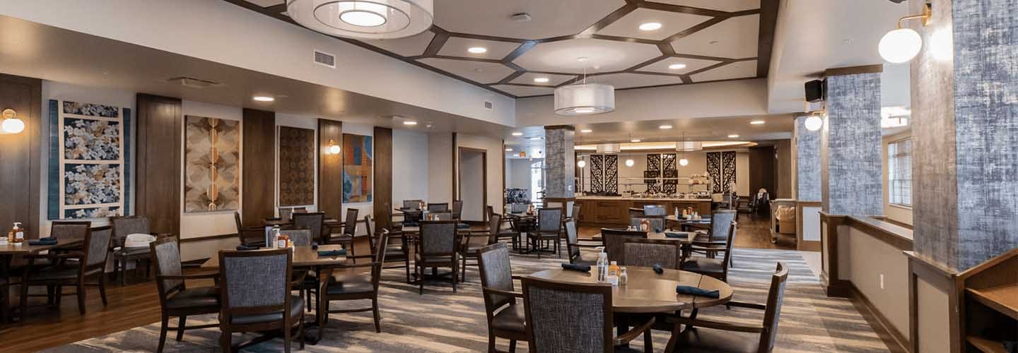 A single dining room serves meals to Sisters, Seniors, and Studentas. Trinity Woods was designed from the beginning to forward the concept of intergenerational Living in this mixed housing project in Milwaukee, Wisconsin