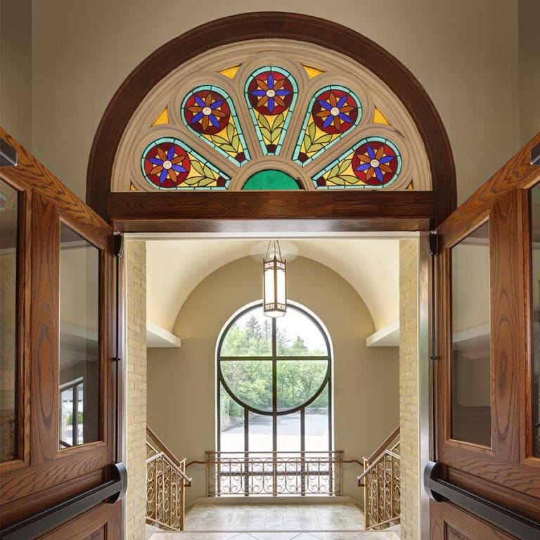 St. Peter Catholic Church Stained Glass at the Narthex and reference to a rose window in the new exterior wall