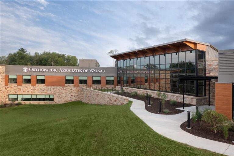 The exterior features abundant glass and brick to create a warm welcome to visitors