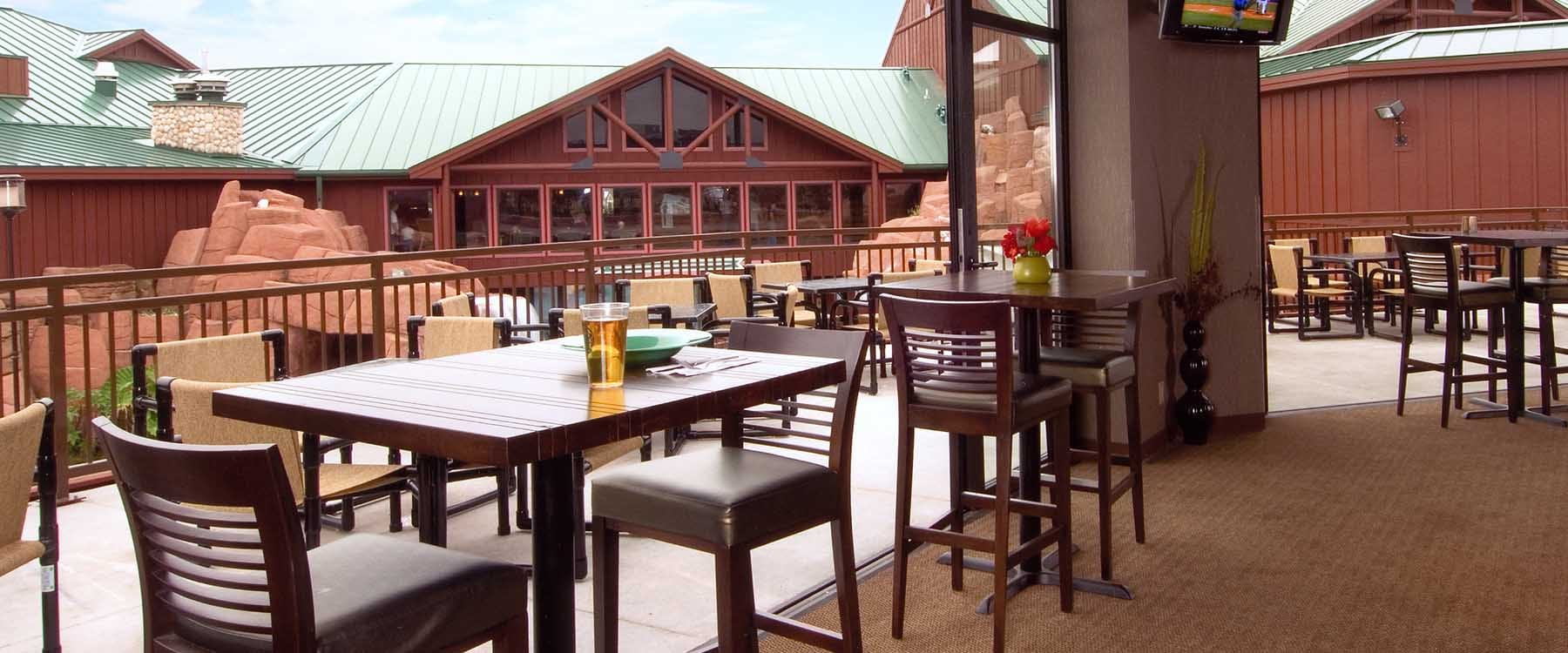 Wisconsin Wilderness Survivors Bar Veranda allows vacationers to socialize and while watching family members in the water. Wisconsin Dells, Wisconsin