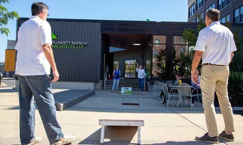 PRA's Annual Cornhole Tournament outside on the PRA Plaza. Rachel Wahlin tosses a bag at the board